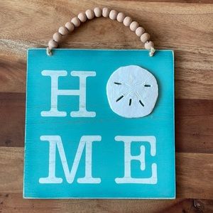 Sand dollar hanging “home” sign